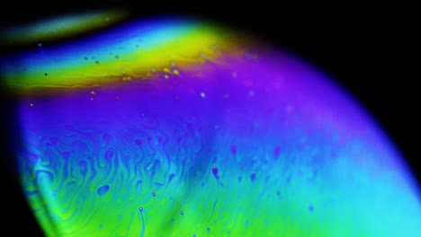 4k stable shots of soap balloons showing the colors of the macro world through a microscope perspective