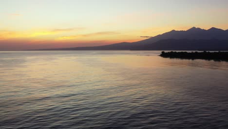 Philippines,-Aerial-panorama-of-the-islands-in-the-ocean-on-the-purple-sunset