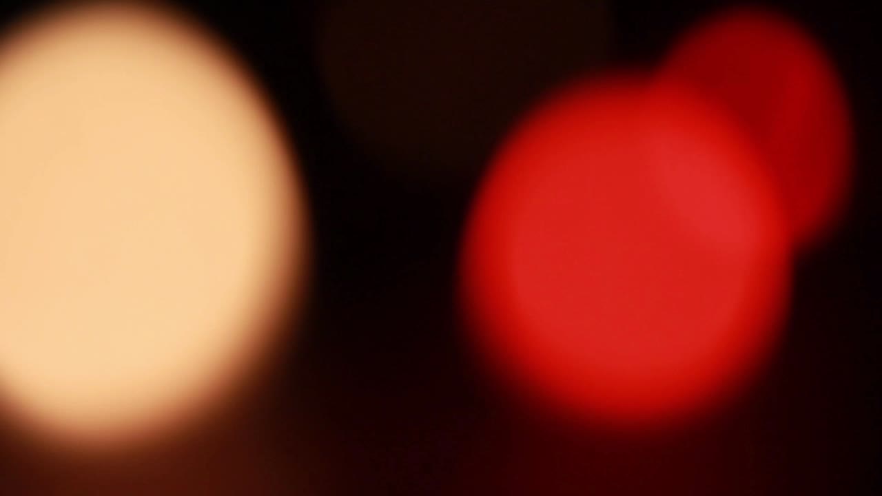 Abstract Warm and Red Bokeh Lights on Dark Background