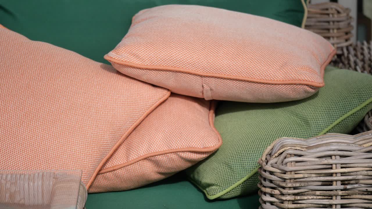 Pile of Cushions and a Wicker Basket