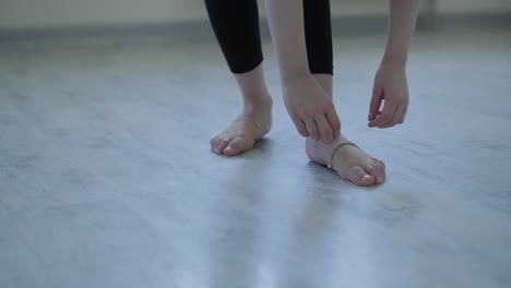 Young ballet girl at studio lesson. Training performance. Stretching exercise pose. Ballerina practice balance technique. Classical elegance fitness.