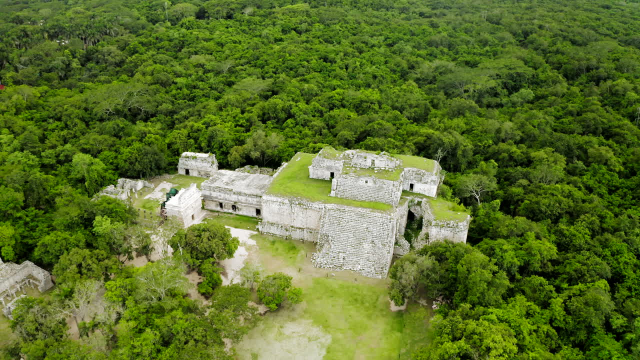 Aerial perspective of the Chichen Itza Pyramid, court, observatory, all the buildings and jungle from above