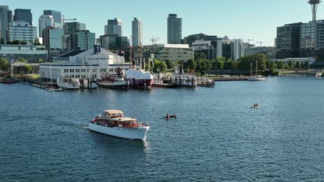 Aerial-view-of-a-nice-boat-cruising-through-Seattle's-Lake-Union