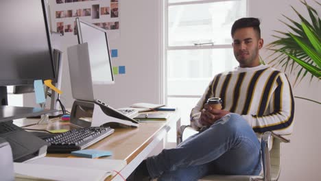 mixed race man working in creative office