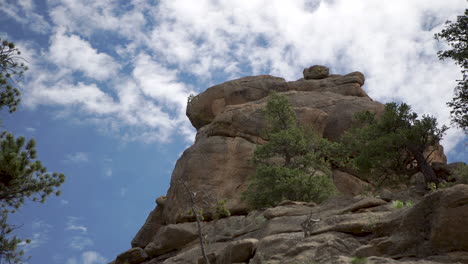 time lapse of clouds above cool rock formation