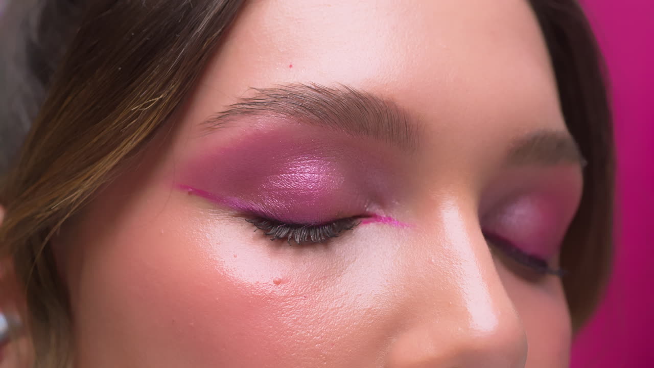 Beautiful blonde girl squints her eyes imagining something, close up