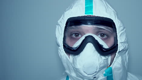 Close-up-shot-of-female-covid-doctor-with-full-covered-personal-protective-equipment