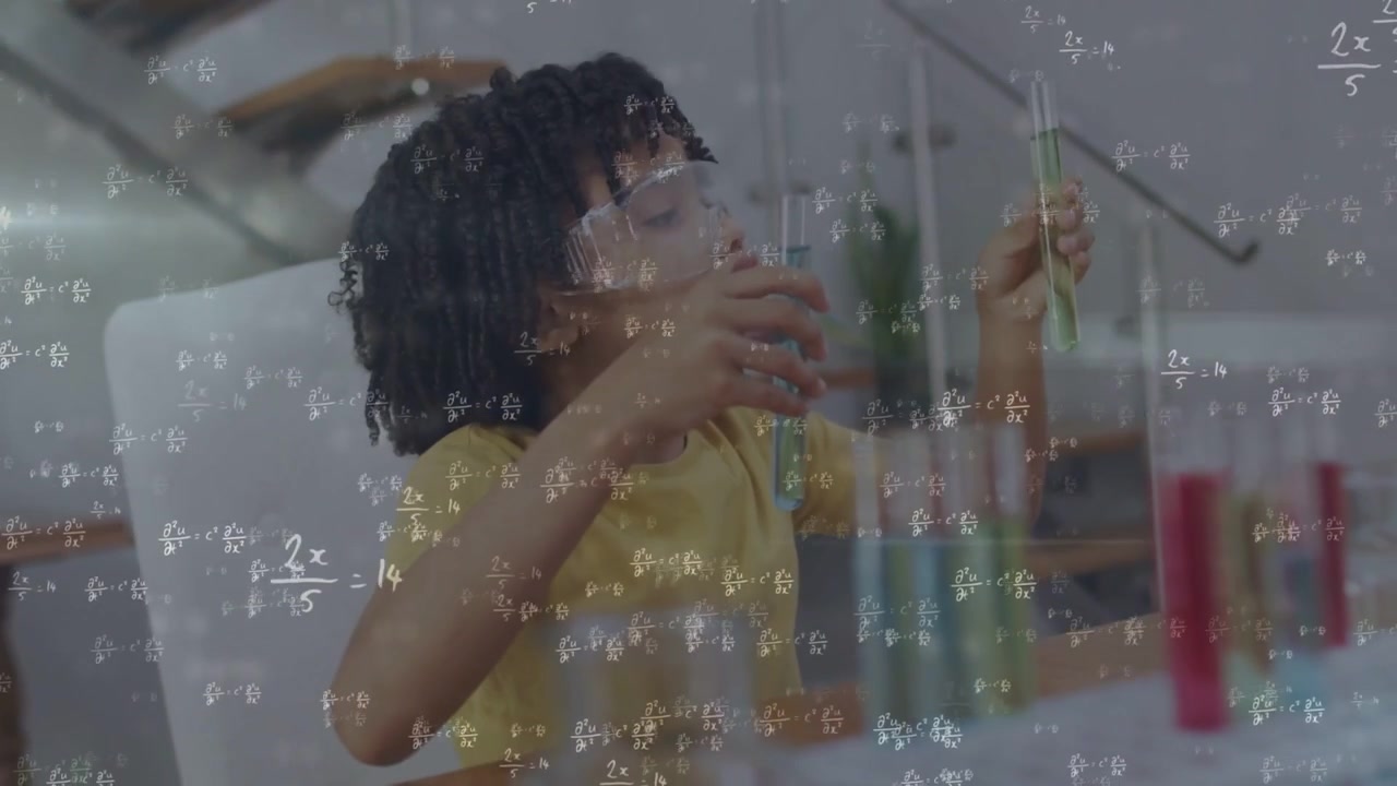 Vertical video: Boy in goggles lifting test tubes, comparing colors for STEM, equations floating