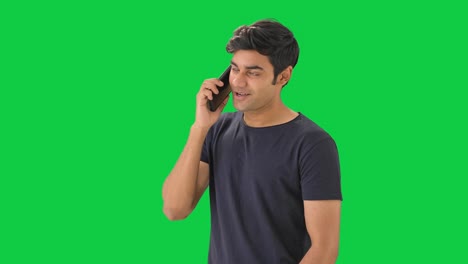 Indian-boy-talking-to-his-girlfriend-on-call--Green-screen