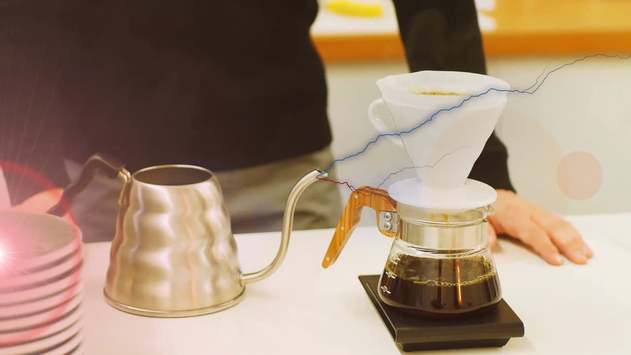Animated illustration of pour-over coffee dripper on glass carafe weighing on scale beside kettle