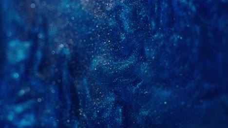 abstract deep blue with glitter particles