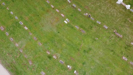 cemetery-graveyard-drone-aerial-footage-Grand-Rapids-Michigan-with-green-foliage-and-trees-and-gravestones