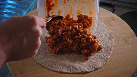 Making-Tortilla-With-Spicy-Turkey-And-Beans-Filling