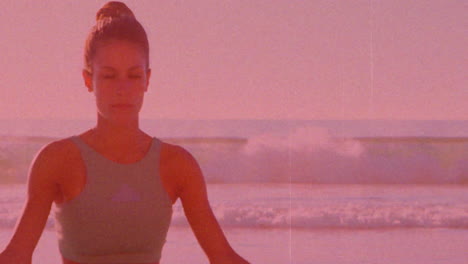 meditating on beach, woman practicing yoga over pink-tinted animation