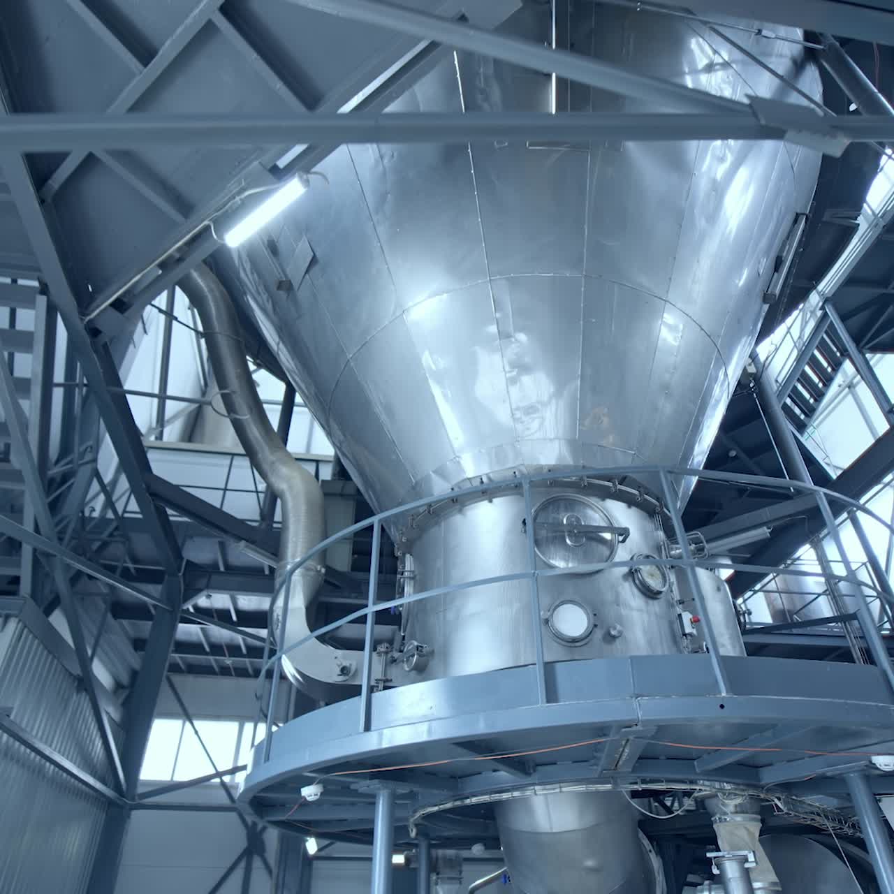 Manufacturing for milk products indoors. Stainless equipment inside the dairy factory. Modern milk production factory