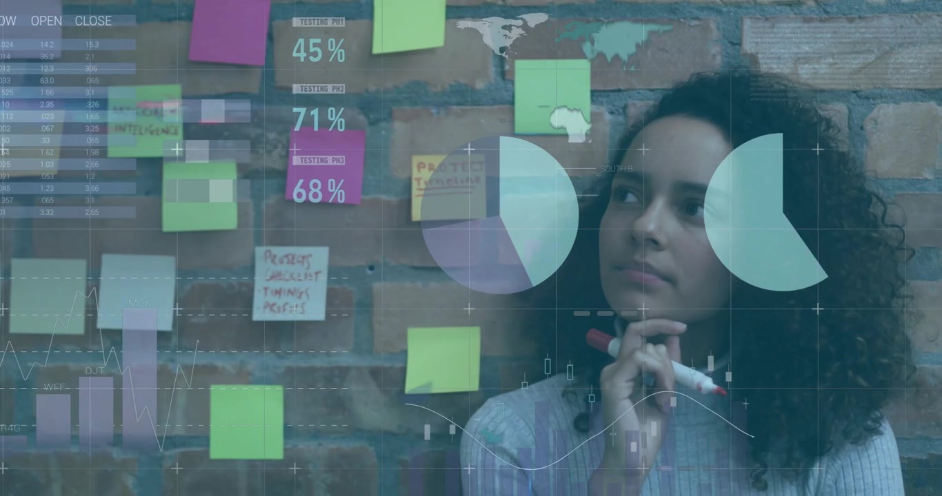 Business analyst studying sticky notes, following data overlays appearing and writing insights