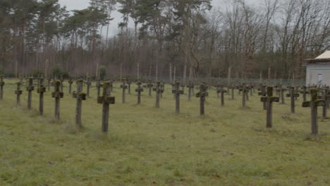 panning fast over large abandoned graveyard with rows of old gravestones