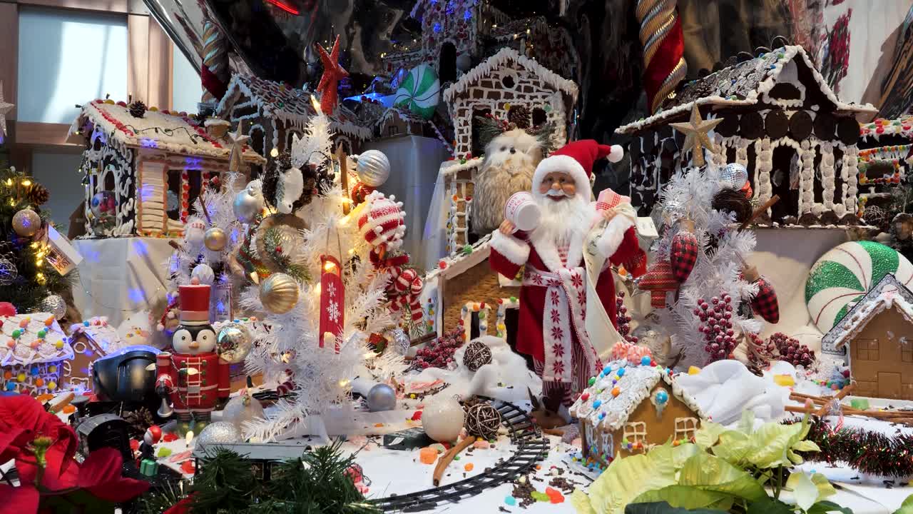 Christmas decorations arrangement, Christmas traditions with Santa Claus, gingerbread houses, candies, toys, Christmas tree.