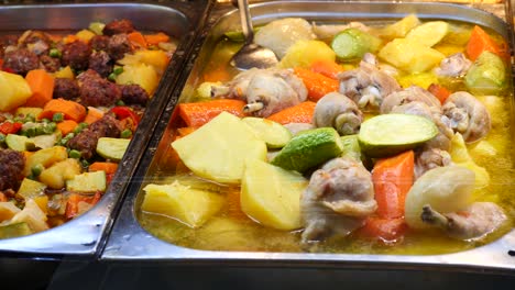 chicken and vegetable stew in a buffet line