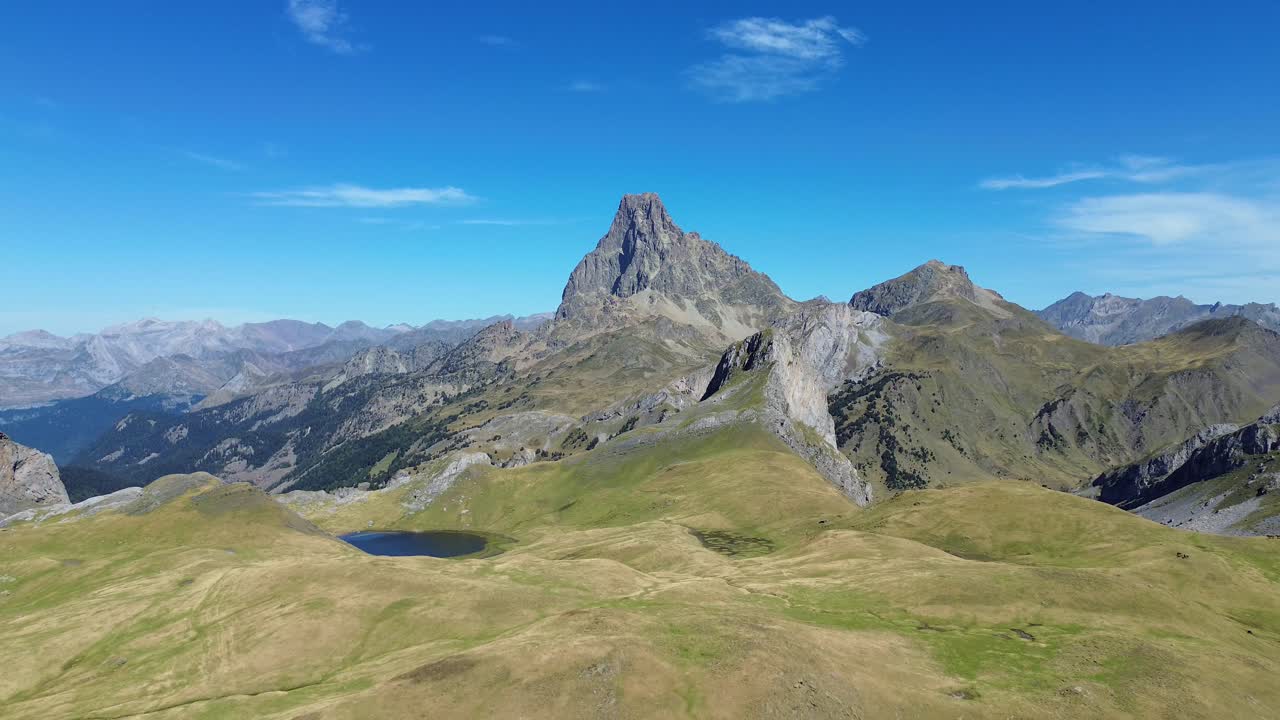 Serene view of Midi d'Ossau mountain in France with clear blue skies
