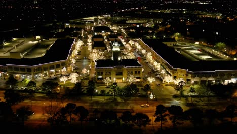 night drone video of the lacenterra shopping center in katy, texas