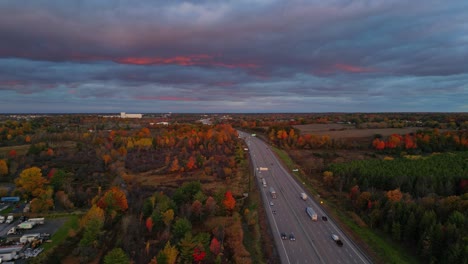 Aerial-fall-morning-light-over-a-highway