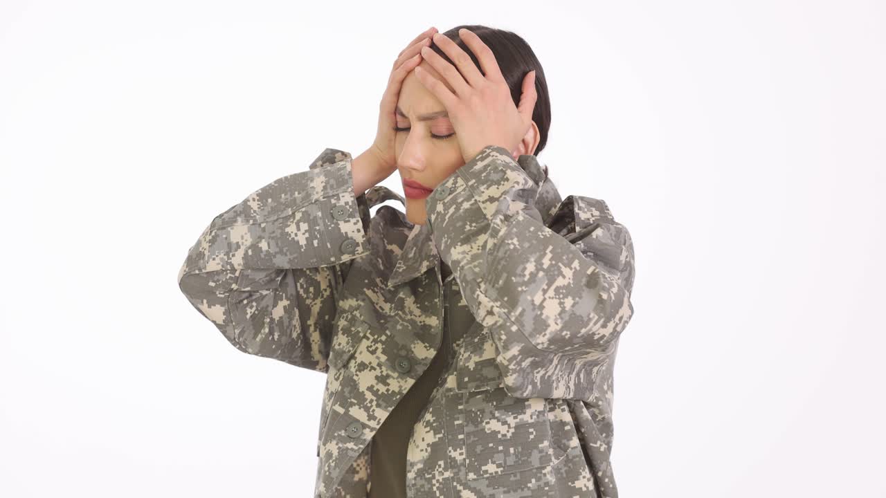 Woman in Military Camouflage Uniform Suffering from Headache or Stress