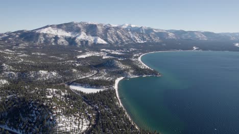 a high-flying, 4k drone shot over lake tahoe, california, during the winter season