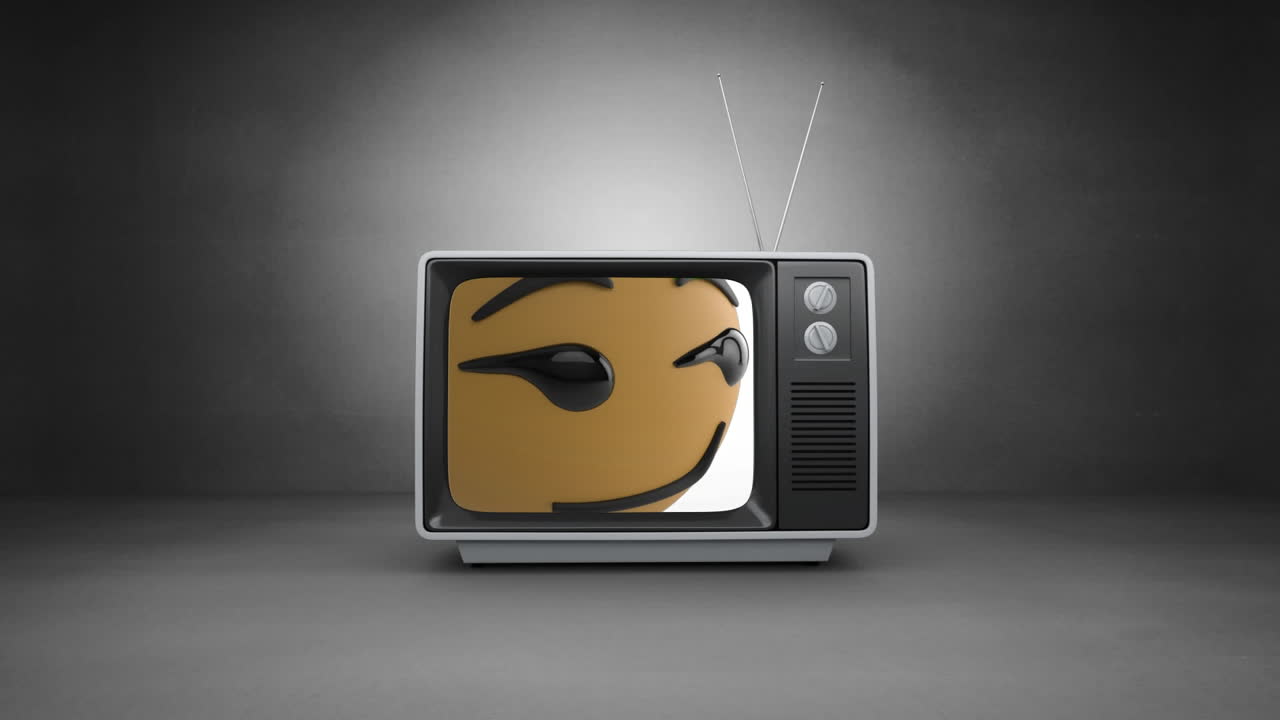 Animazione digitale di un'emoji di faccina con ghigno su schermo televisivo su sfondo grigio.