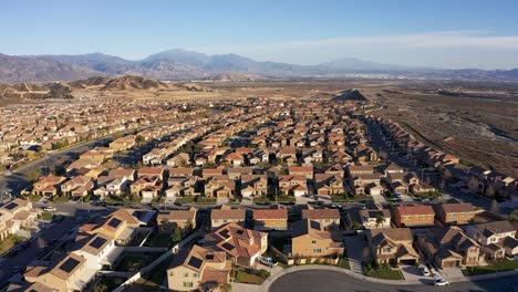 wide aerial descending shot of a desert master-planned community development