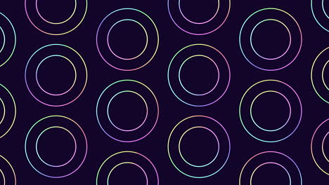 circular pattern of purple and blue circles on black background