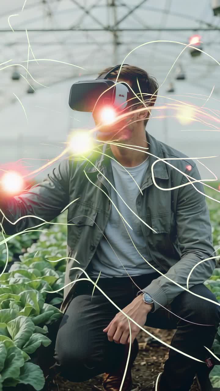Vertical video: Activating VR, man kneeling selecting nodes analyzing greenhouse crops with headset