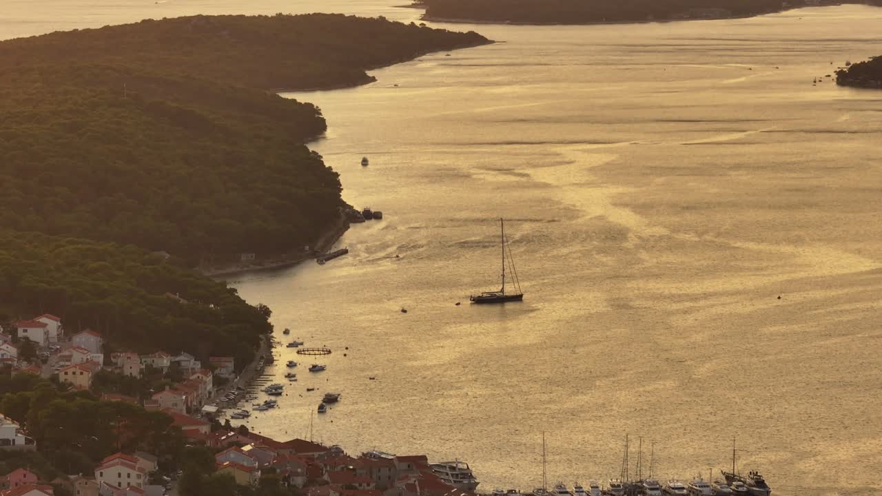 Experience the breathtaking beauty of Mali Lošinj at sunset through stunning aerial footage. Watch as the sun sets over the crystal-clear waters and picturesque coastline