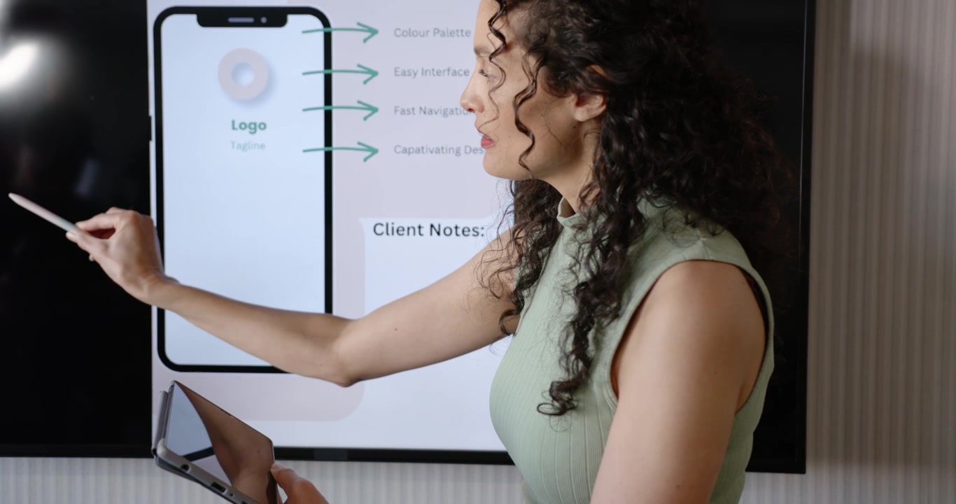 Glancing at tablet, African American woman pointing stylus at display, highlighting Client Notes