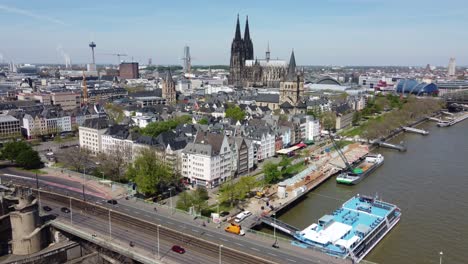 neighborhood around cologne cathedral, cityscape, and busy streets of cologne at river rhine, germany