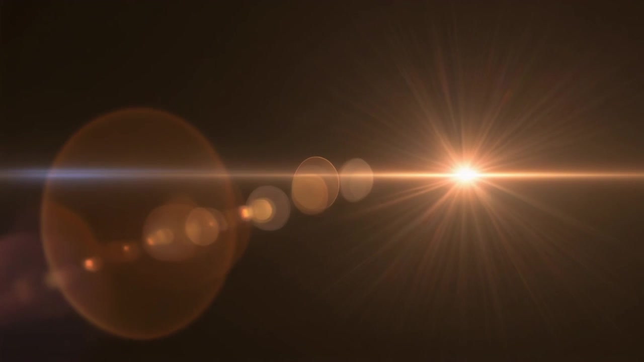 Bagliore dorato brillante che si muove su sfondo scuro