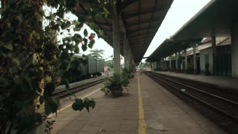 revealing saigon vietnam train station without people and cargo train on the rail track