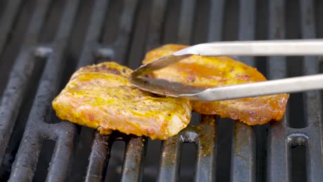 preparing fresh meat on a gas bbq grill