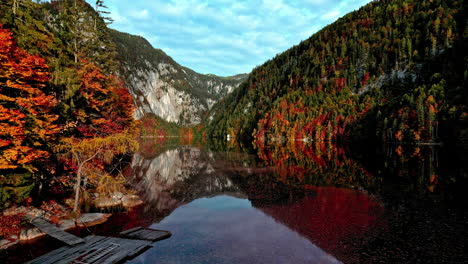 Picturesque-landscape-of-dense-autumn-foliage-in-the-mountain-forest-of-the-Austrian-Alps,-Europe