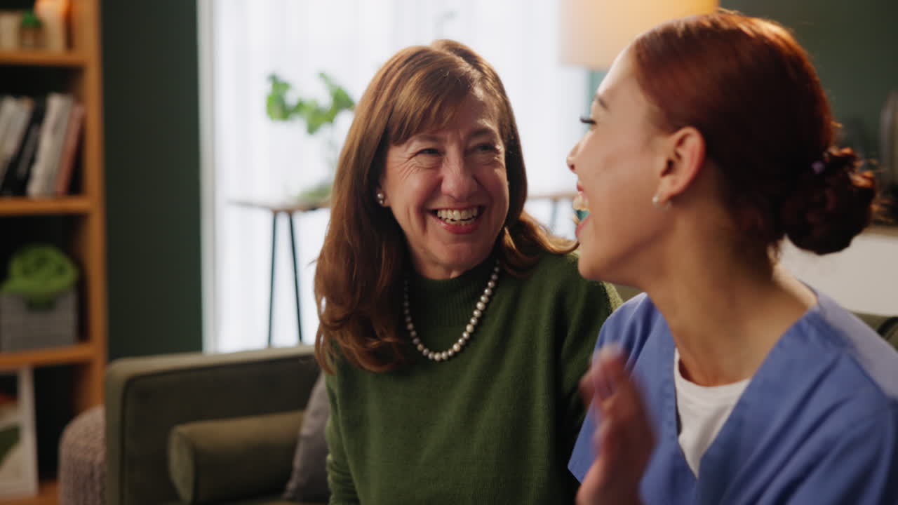 Nurse providing care to senior woman at home