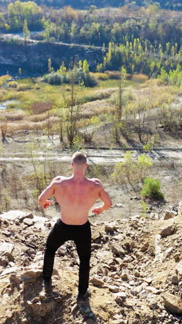 athletic men posing with muscles. aerial view of handsome bodybuilders with perfect muscular body posing outdoors