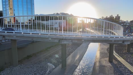 slow aerial dolly in shot capturing daily commuting vehicles driving on newly constructed puente ramón bautista mestre in the early morning in cordoba metropolitan area