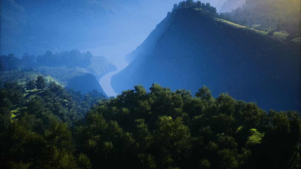 Serene river winding through lush hills in early morning light