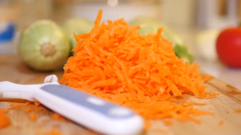 chopped carrots on a wooden cutting board