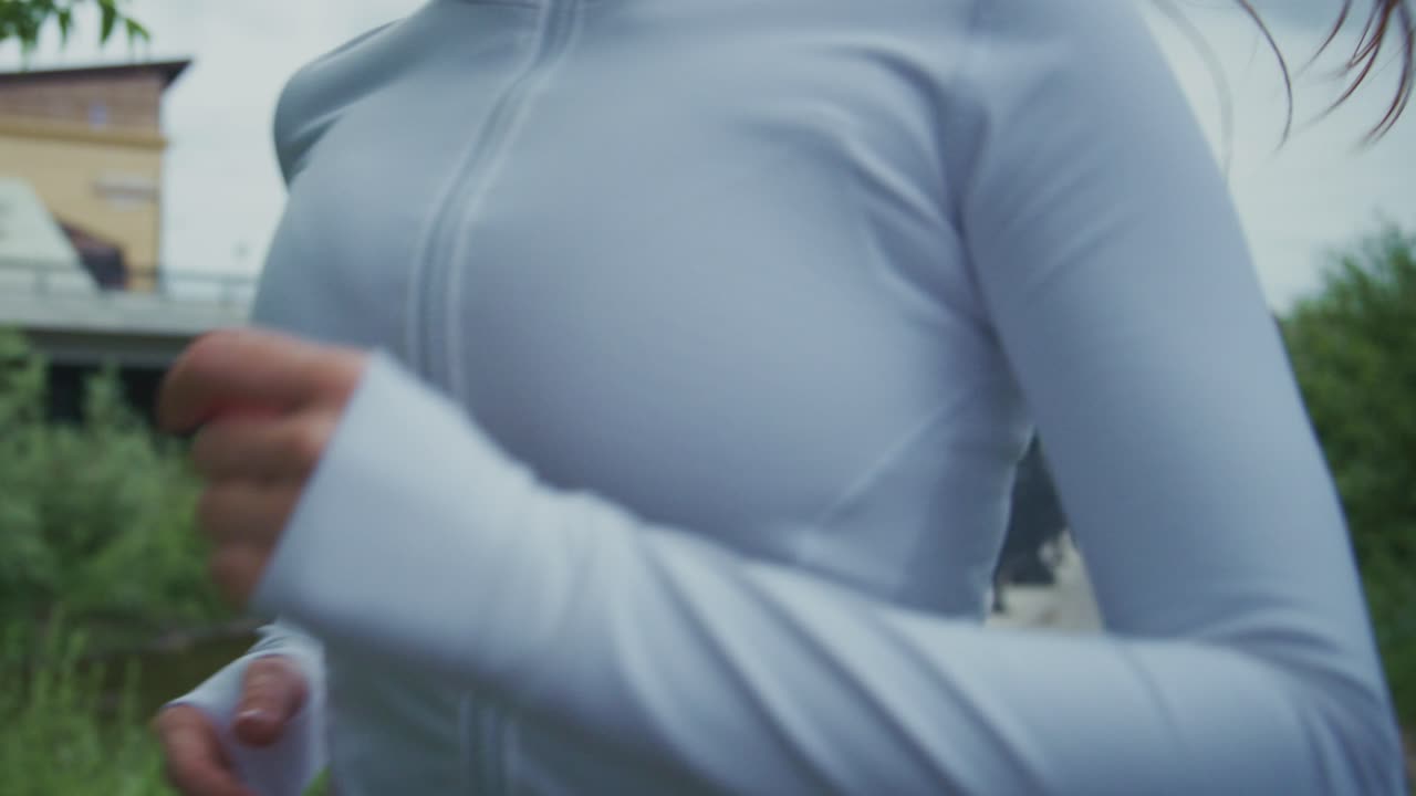 Woman Running Outdoors with Headphones