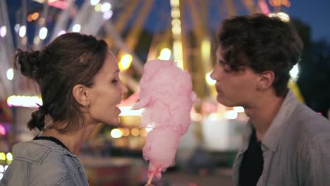 Two-Hipsters-On-Dating-In-Funfair-At-Night