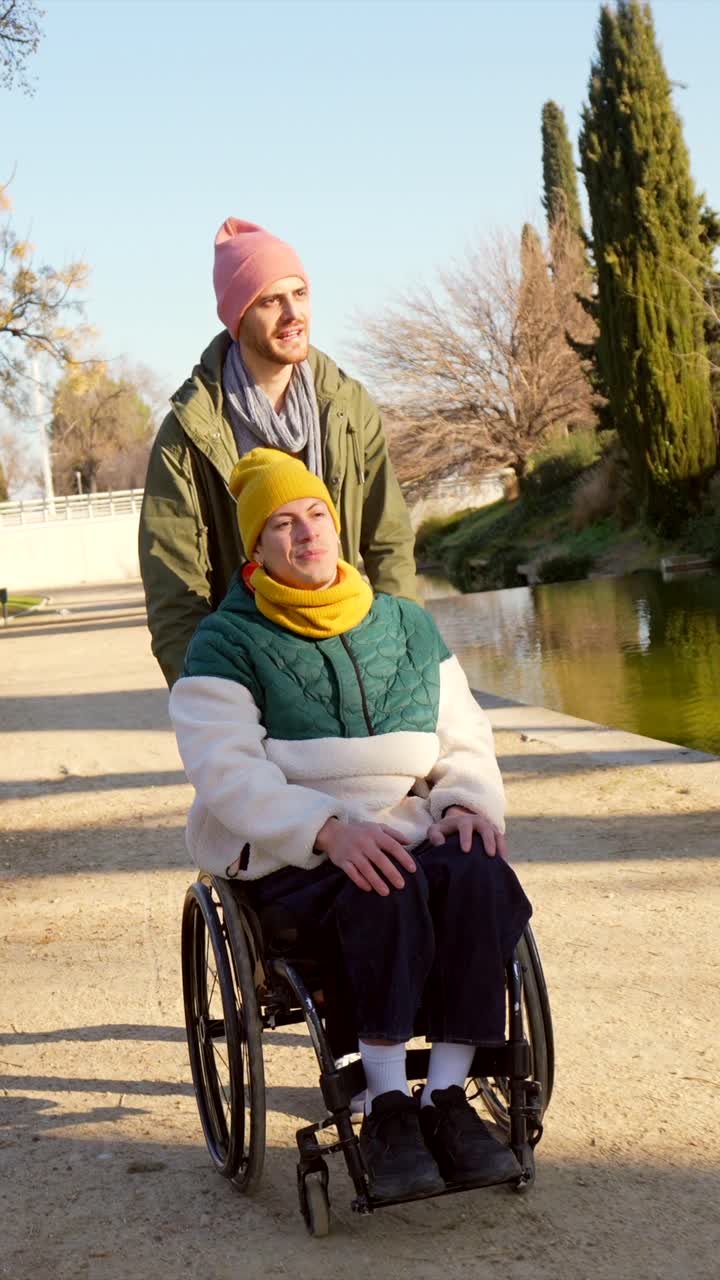 Couple Enjoying a Walk in the Park with a Wheelchair