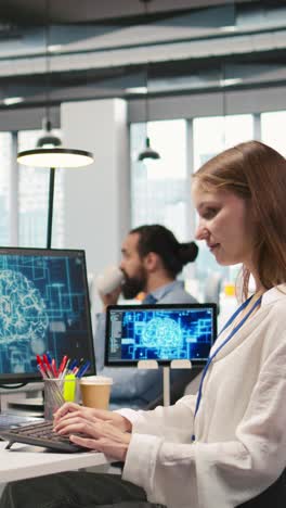 vertical video junior dev in office relies on ai tech to run tasks across multiple devices