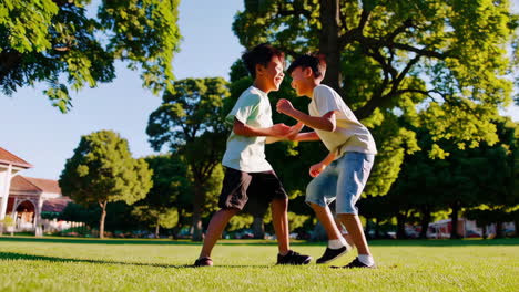 two boys playing in the park