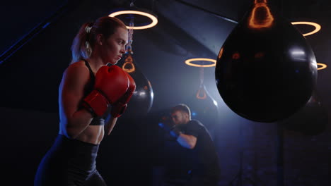 woman and man boxing training session